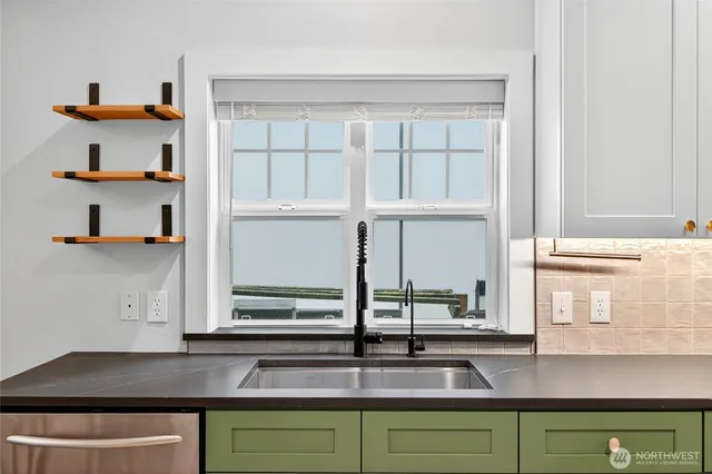 a kitchen with a sink and a window