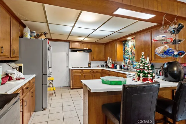 a kitchen with sink cabinets and stove