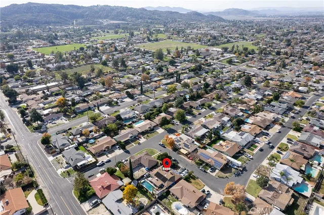 an aerial view of residential houses and outdoor space