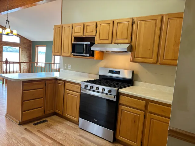 a kitchen with a stove and a sink