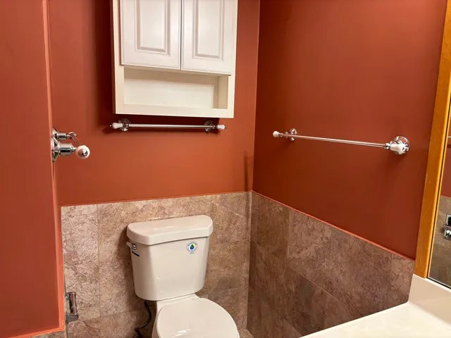a bathroom with a toilet and a sink
