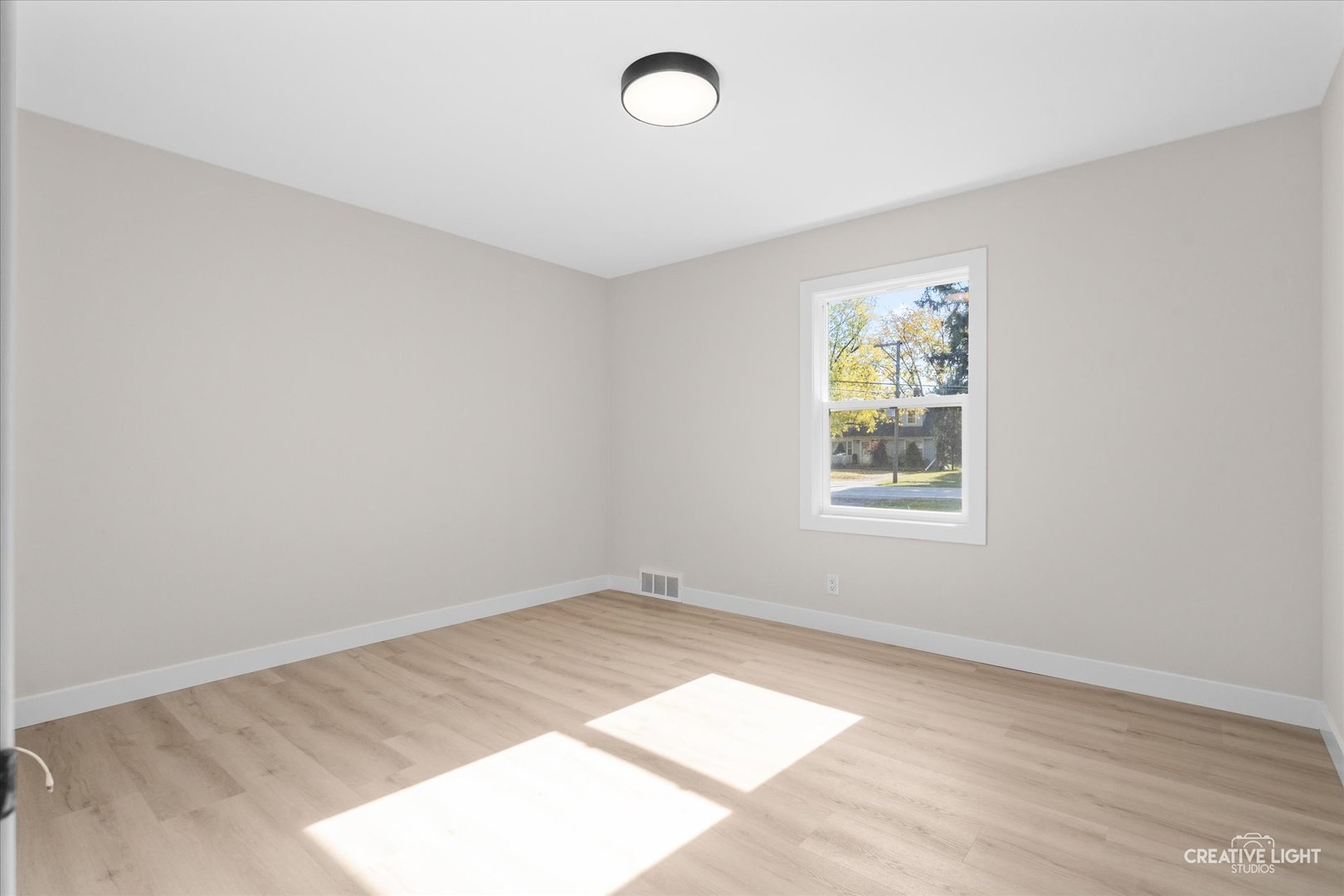 1160 Molitor Road Aurora, IL 60505 - Photo 15 of 20 an empty room with a window