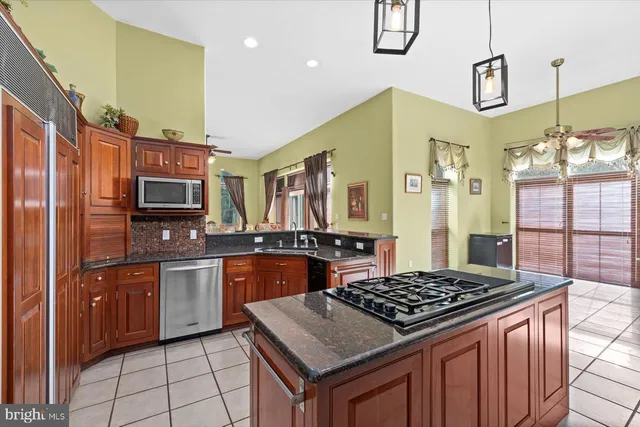 a bathroom with a granite countertop double vanity sink and a mirror