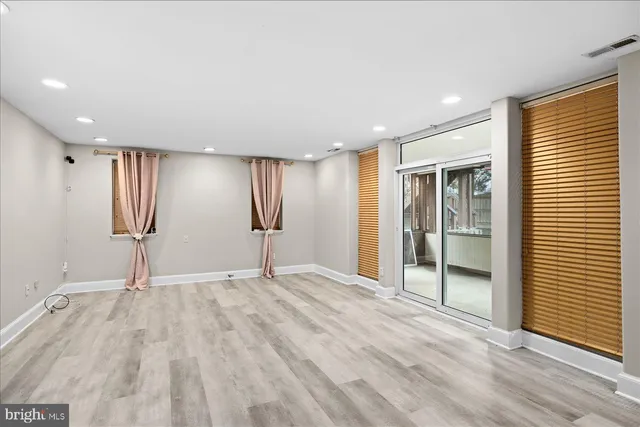 a view of entryway with wooden floor