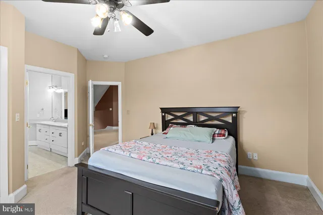 a bedroom with a bed and lamp