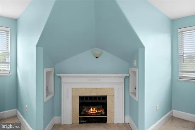 a bathroom with a sink a light fixture and a mirror