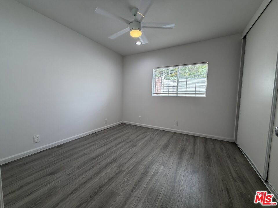 18601 Hiawatha Street Porter Ranch, CA 91326 - Photo 11 of 22 an empty room with wooden floor and windows