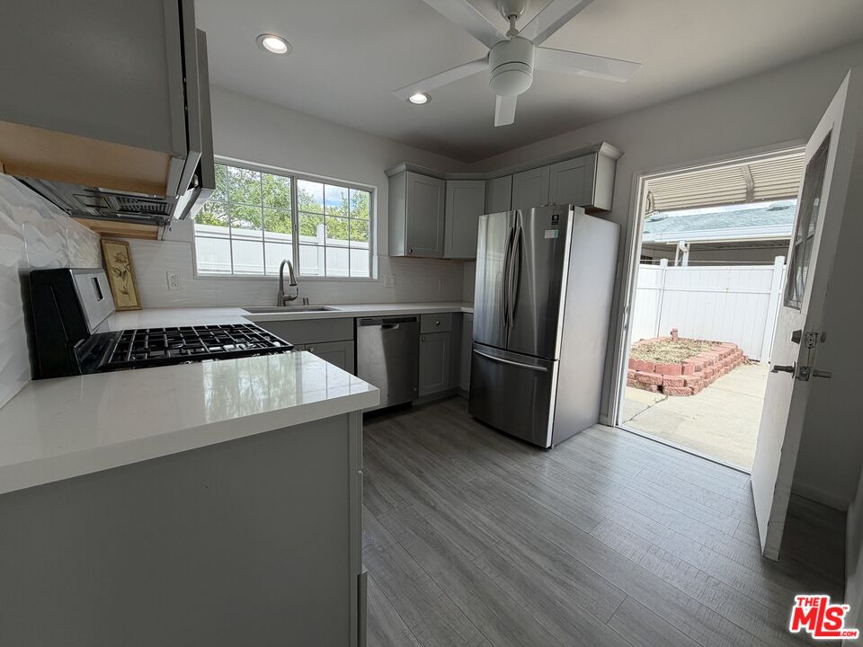 18601 Hiawatha Street Porter Ranch, CA 91326 - Photo 13 of 22 a kitchen with refrigerator and window