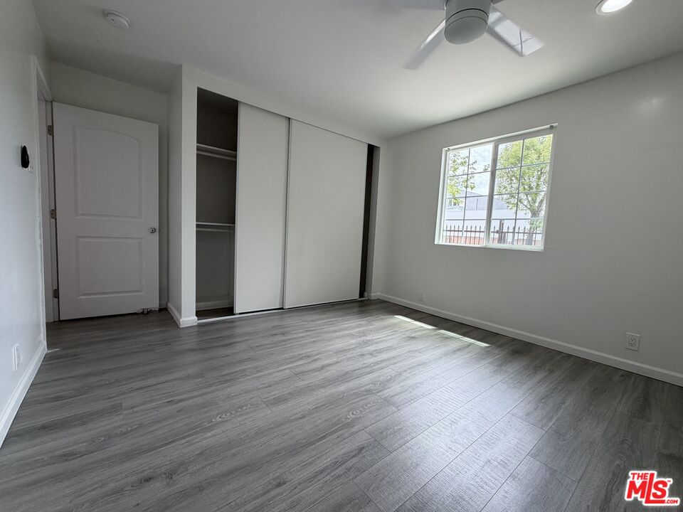 18601 Hiawatha Street Porter Ranch, CA 91326 - Photo 16 of 22 an empty room with wooden floor and windows