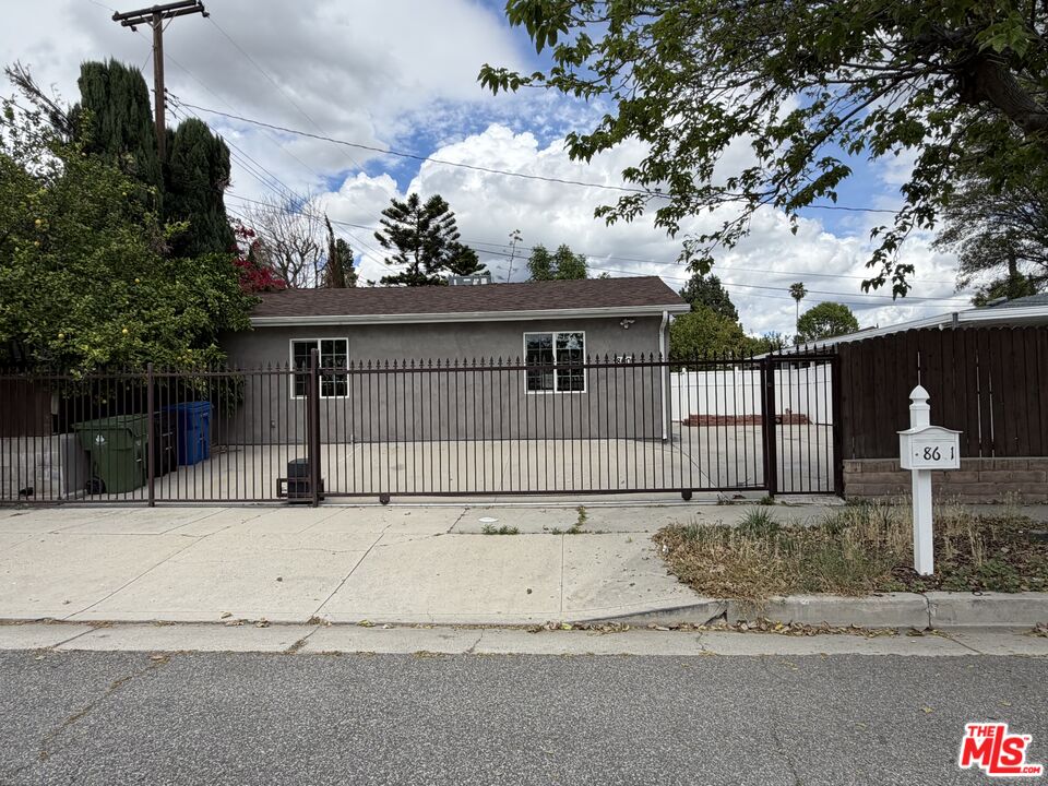 18601 Hiawatha Street Porter Ranch, CA 91326 - Photo 17 of 22 a front view of a house with a tree