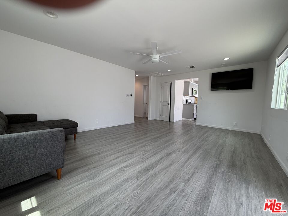 18601 Hiawatha Street Porter Ranch, CA 91326 - Photo 3 of 22 a living room with furniture and a flat screen tv