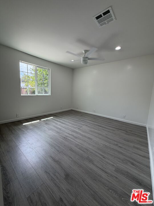18601 Hiawatha Street Porter Ranch, CA 91326 - Photo 6 of 22 an empty room with wooden floor and windows