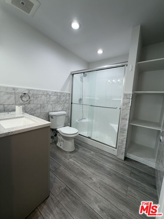 18601 Hiawatha Street Porter Ranch, CA 91326 - Photo 8 of 22 a bathroom with a sink and a mirror