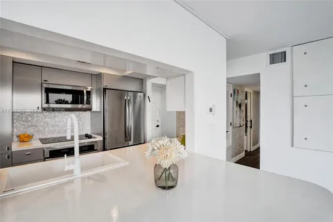 a view of kitchen with furniture and large window
