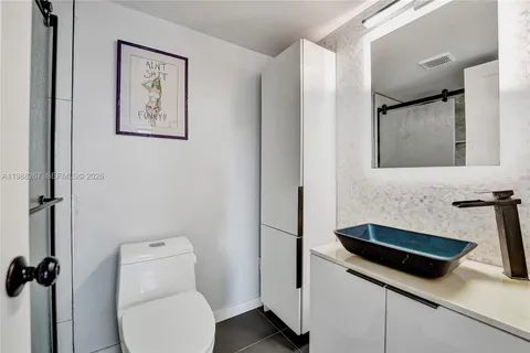 a bathroom with a toilet and a sink