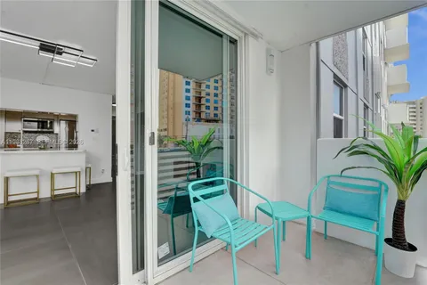 a view of a livingroom with furniture and a potted plant