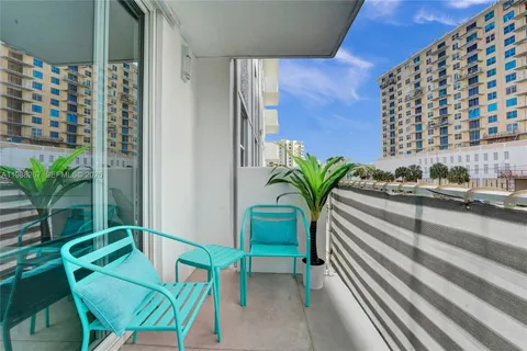 a view of a balcony with chairs