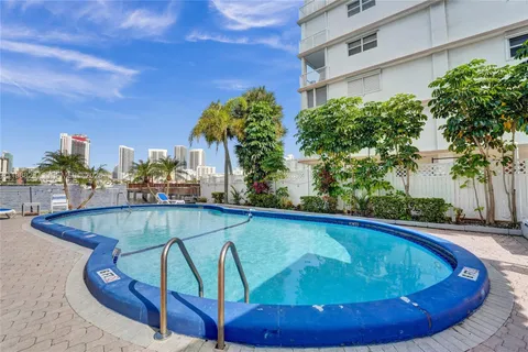 a view of a swimming pool with a patio