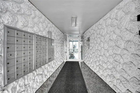 a view of gallery with wooden floor