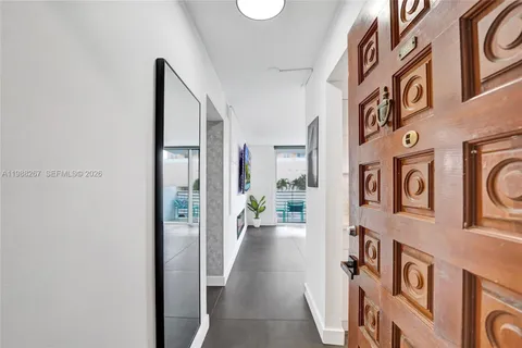 a view of a hallway with a white walls