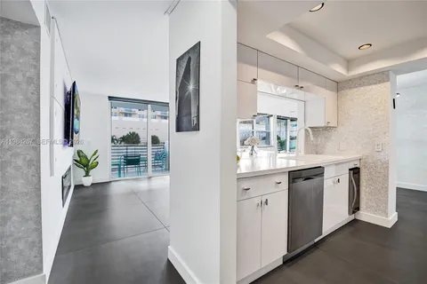 a spacious bathroom with a double vanity sink and a mirror