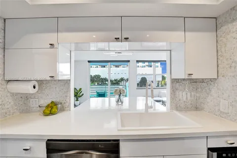 a kitchen with a refrigerator and a window