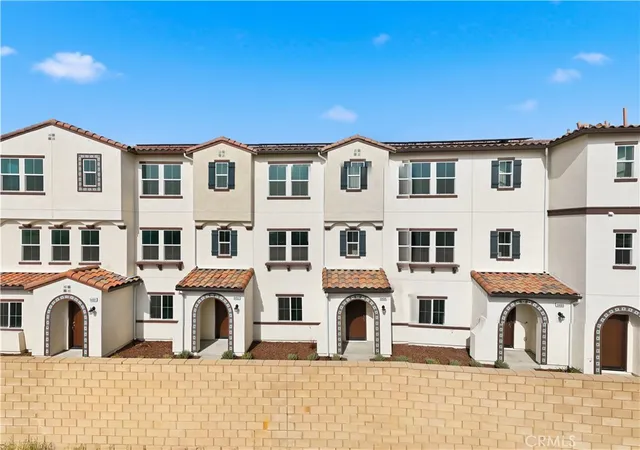 a view of a white building among the street