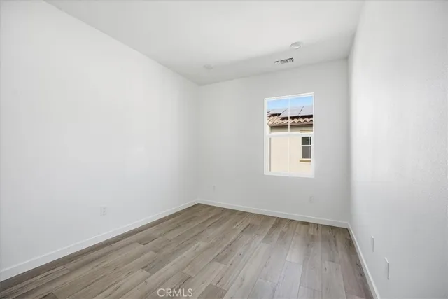 a kitchen with kitchen island a stove a sink and a microwave