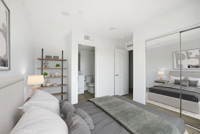 a bedroom with bed and window