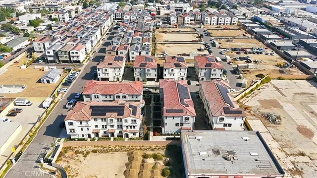 an aerial view of residential building and parking space