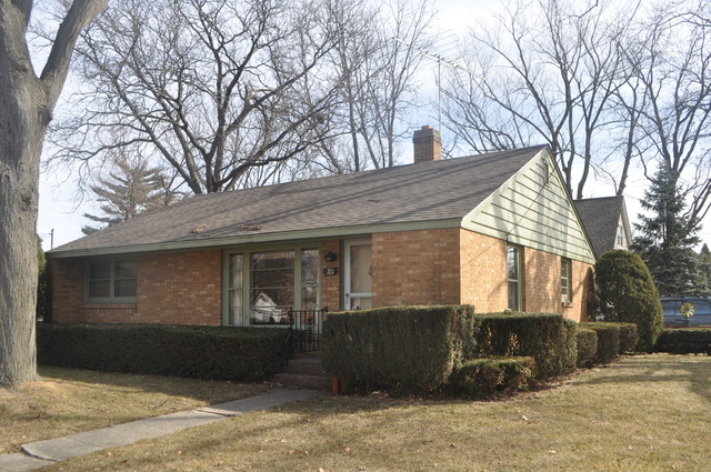 701 Preston Avenue Elgin, IL 60120 - Photo 1 of 13 a front view of a house with a yard