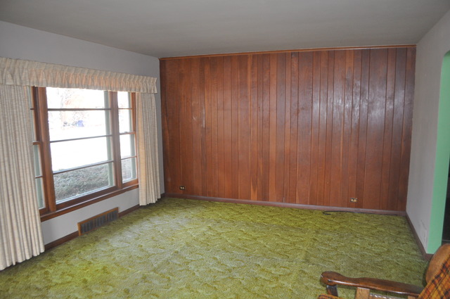 701 Preston Avenue Elgin, IL 60120 - Photo 2 of 13 an empty room with windows