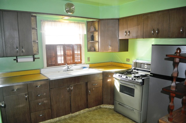 701 Preston Avenue Elgin, IL 60120 - Photo 4 of 13 a kitchen with a sink stove and cabinets