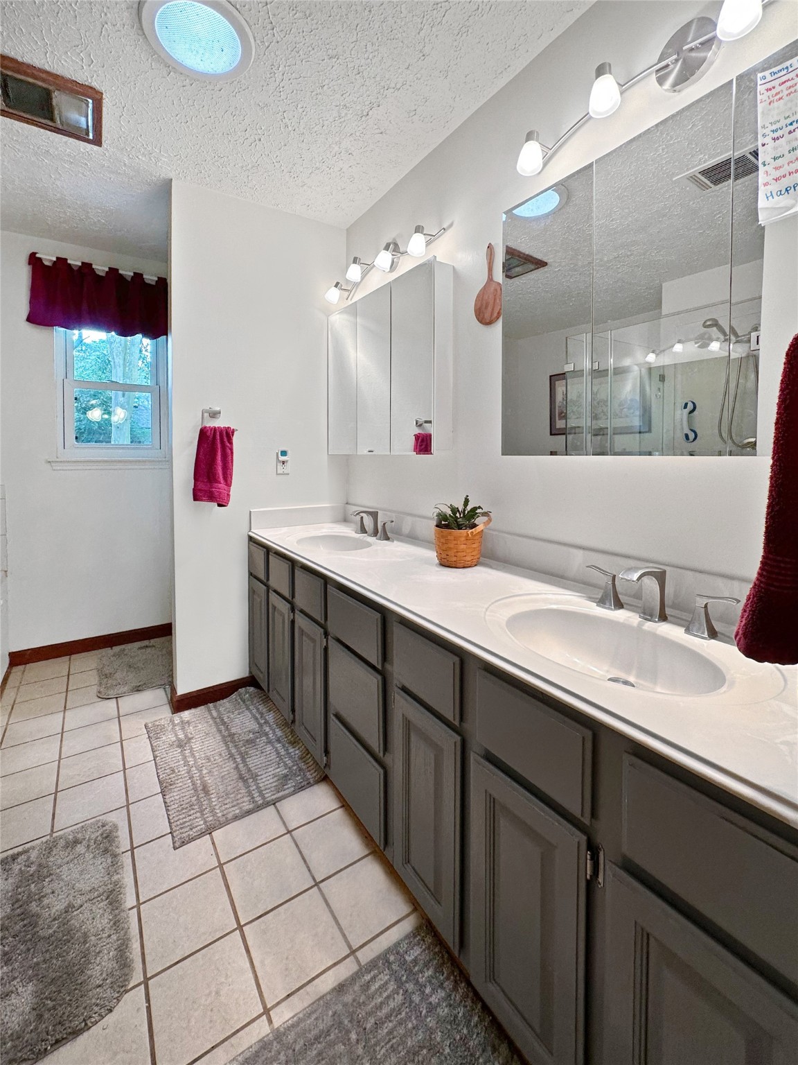 17423 Fairway Oaks Drive Spring, TX 77379 - Photo 13 of 50 a bathroom with a sink mirror and vanity