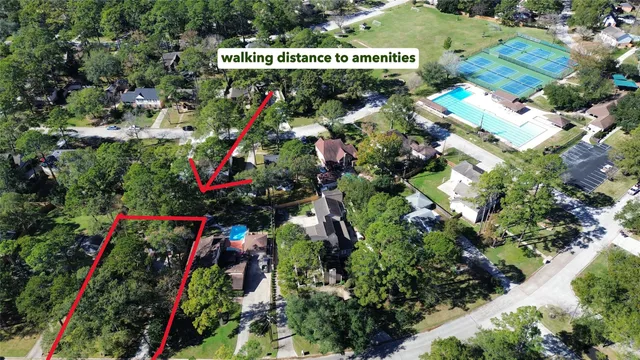 a living room with furniture a fireplace and a large mirror