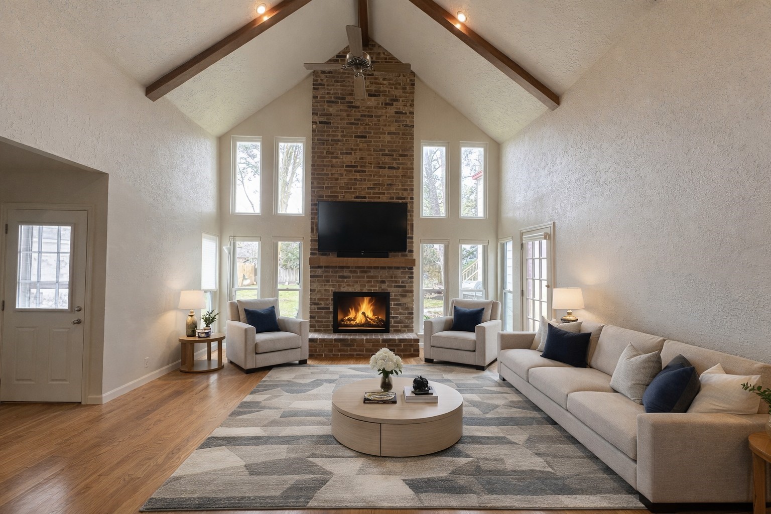17423 Fairway Oaks Drive Spring, TX 77379 - Photo 6 of 50 a living room with furniture a fireplace and a large mirror