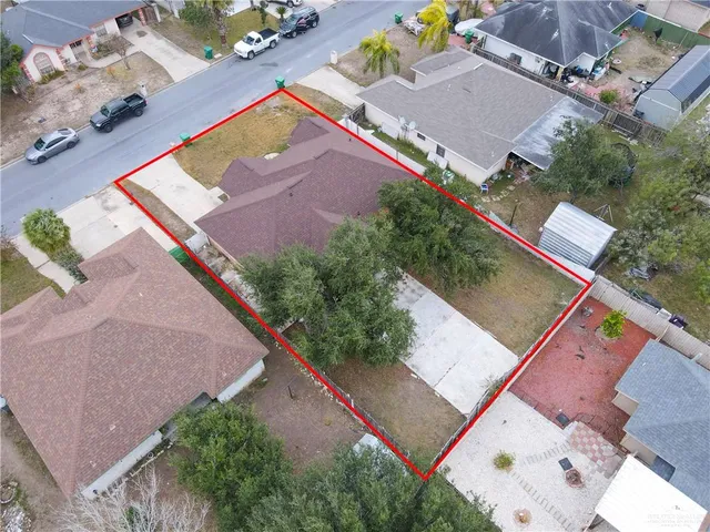 an aerial view of house with yard