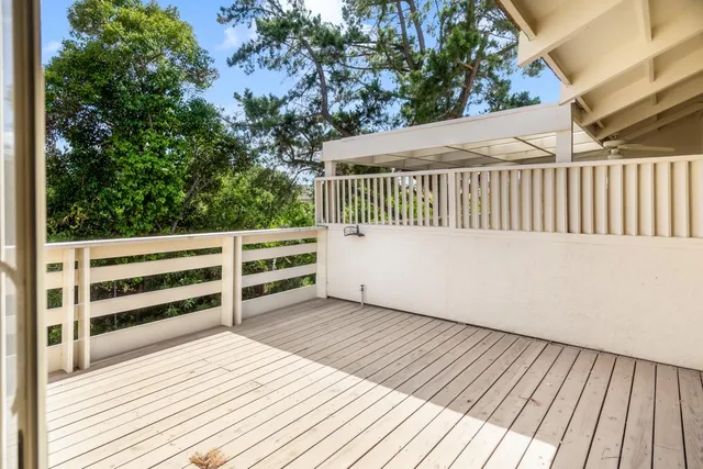 a view of balcony with wooden floor
