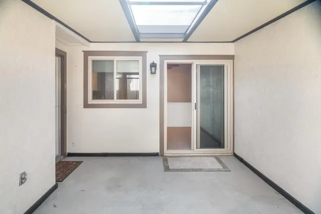 a view of a swimming pool with a patio and swimming pool