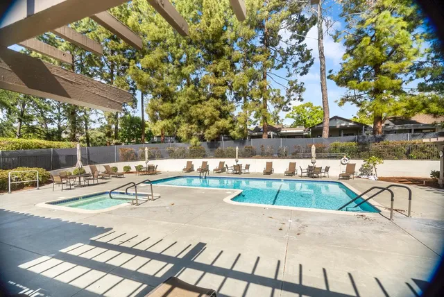 a view of a patio with table and chairs and potted plants