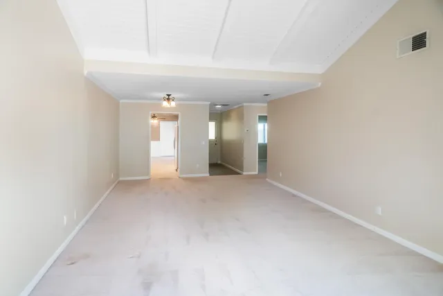 a kitchen with a refrigerator and a sink