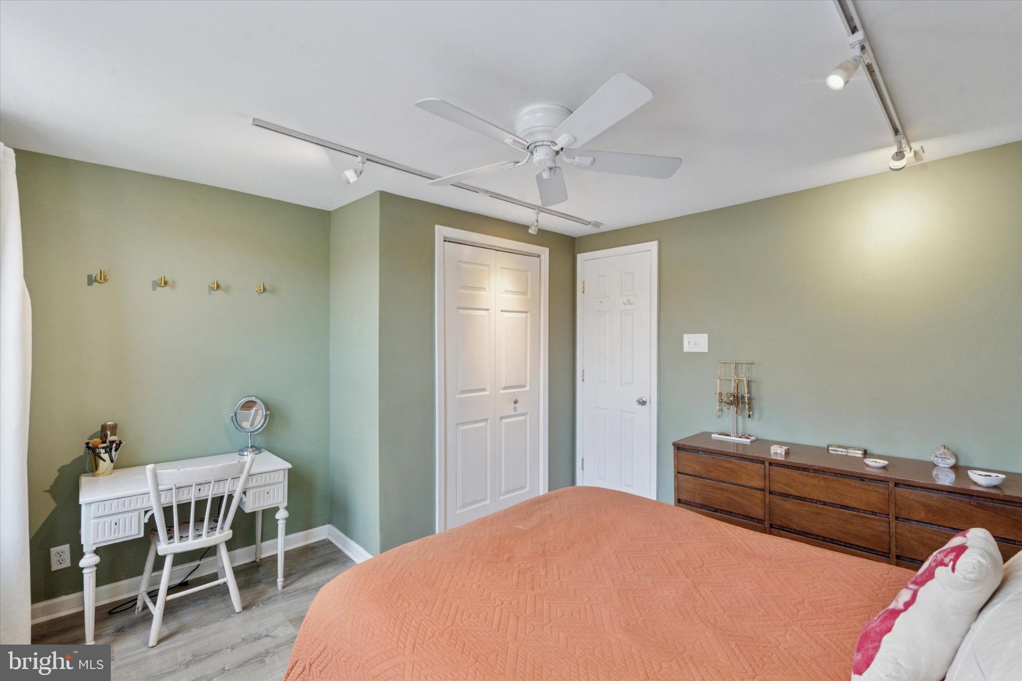 804 Sears Street Philadelphia, PA 19147 - Photo 13 of 25 a bedroom with a bed and a chandelier