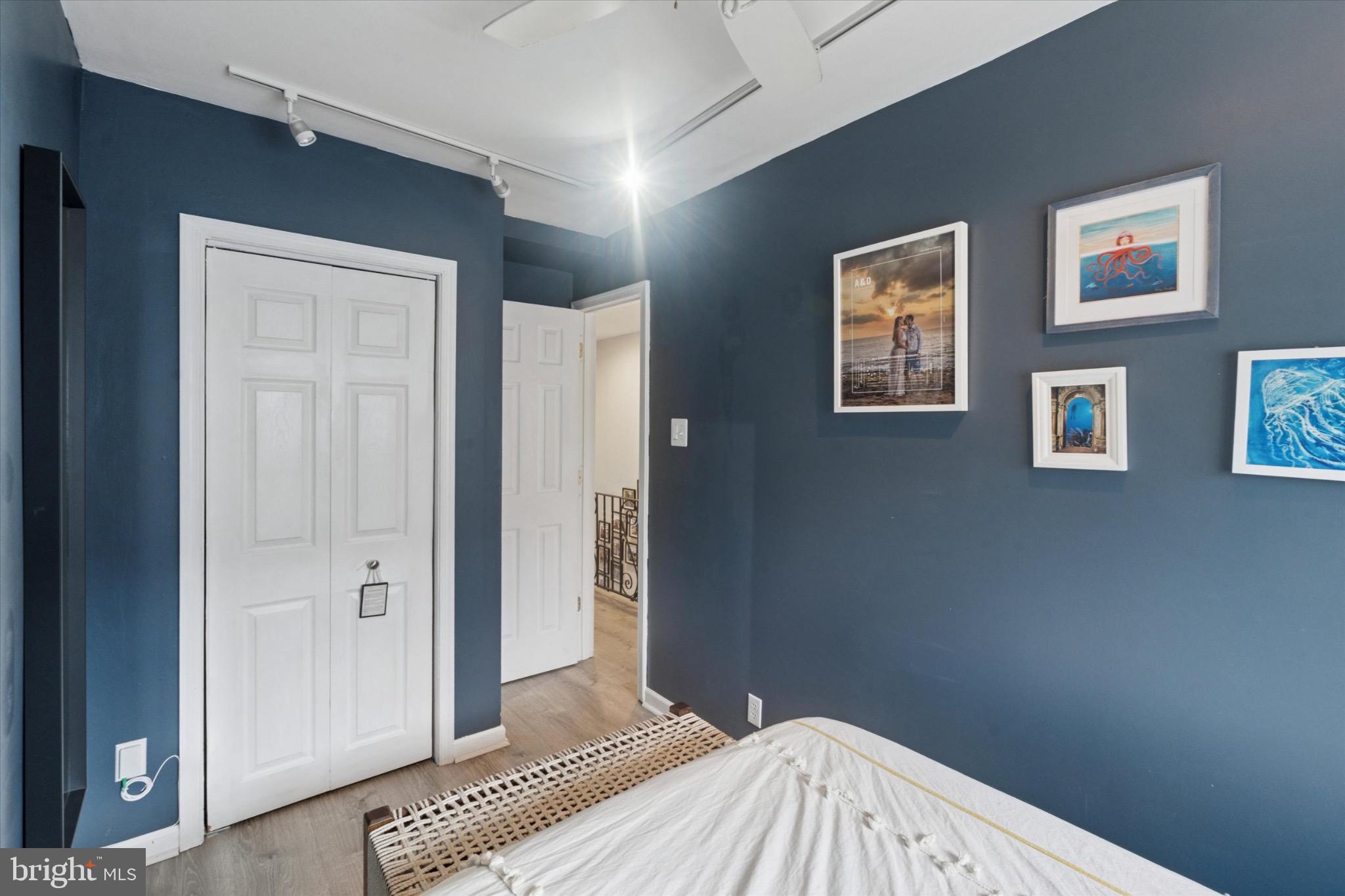 804 Sears Street Philadelphia, PA 19147 - Photo 16 of 25 a bedroom with a bed and a painting on the wall