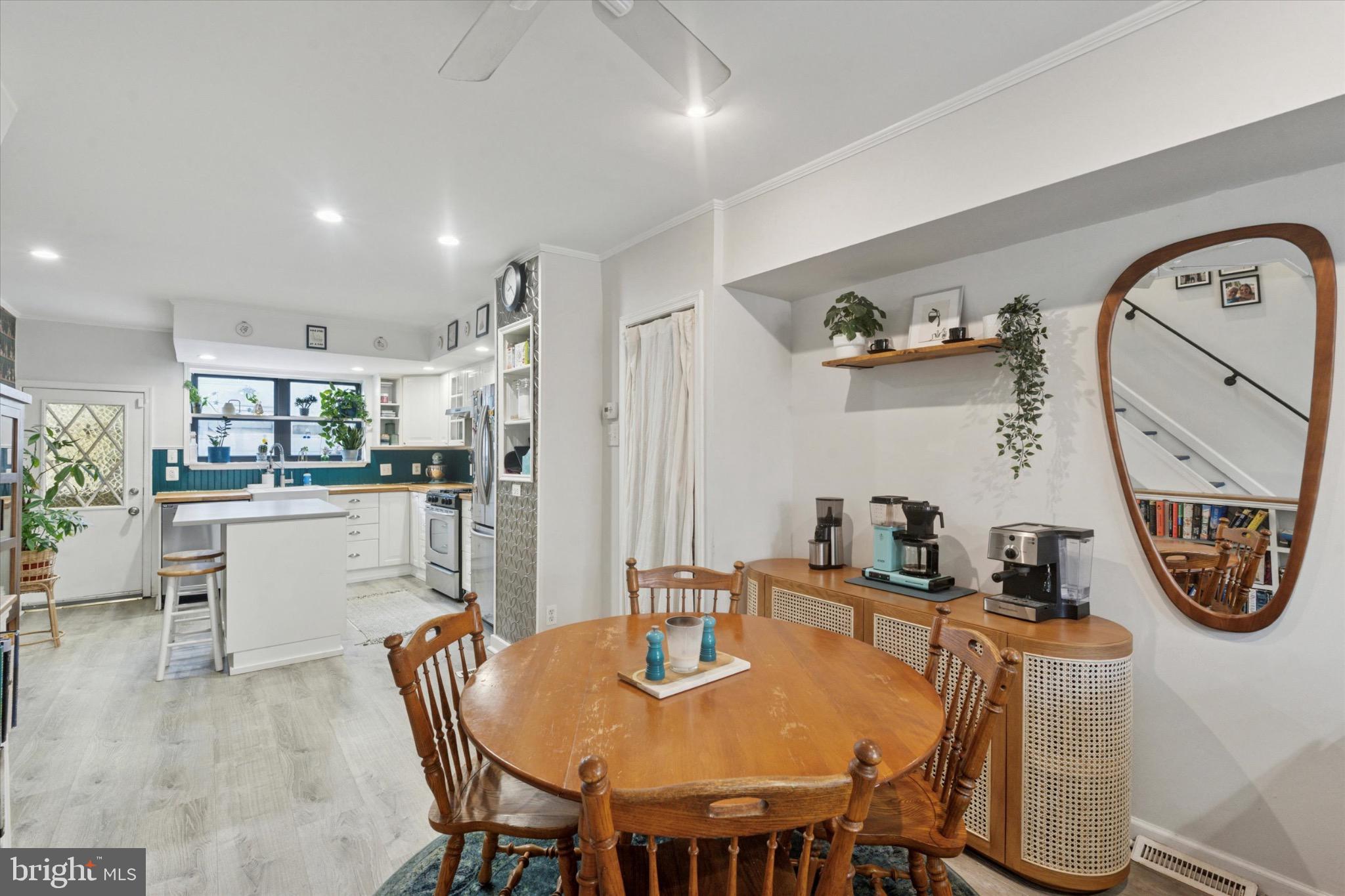 804 Sears Street Philadelphia, PA 19147 - Photo 6 of 25 a dining room with kitchen island a table and chairs in it