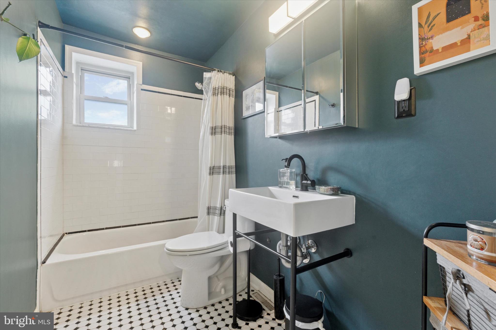 804 Sears Street Philadelphia, PA 19147 - Photo 10 of 25 a bathroom with a sink toilet a mirror and shower