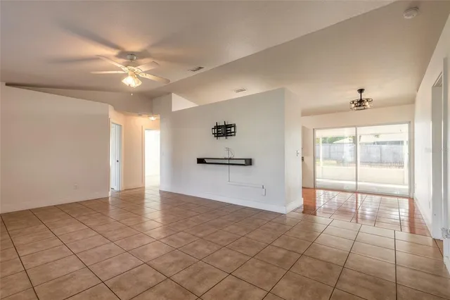 a view of a kitchen with a sink and a refrigerator