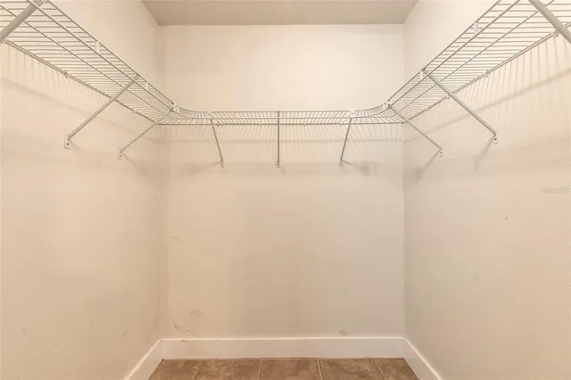 a bathroom with a sink toilet and a mirror