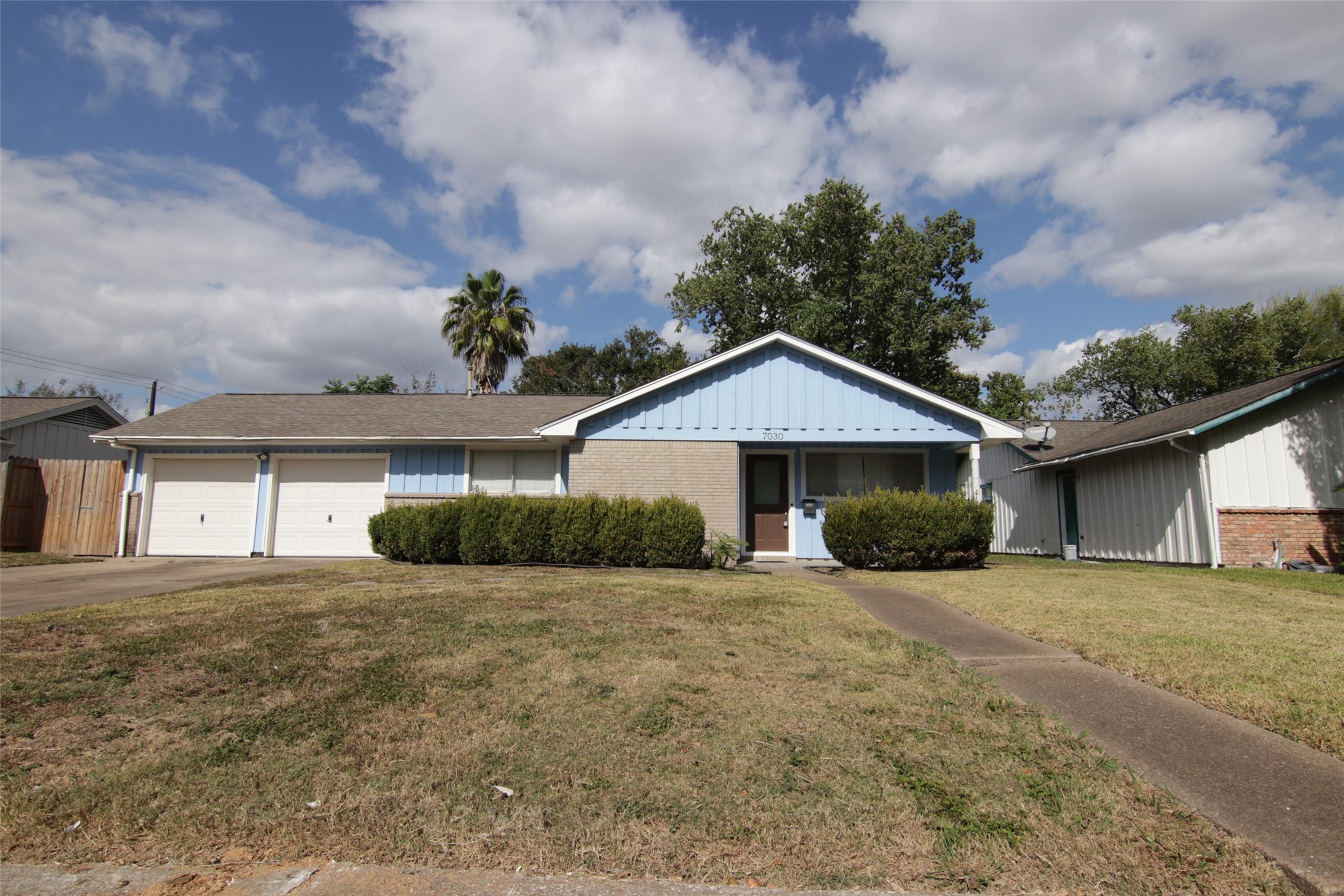 front view of a house with a yard