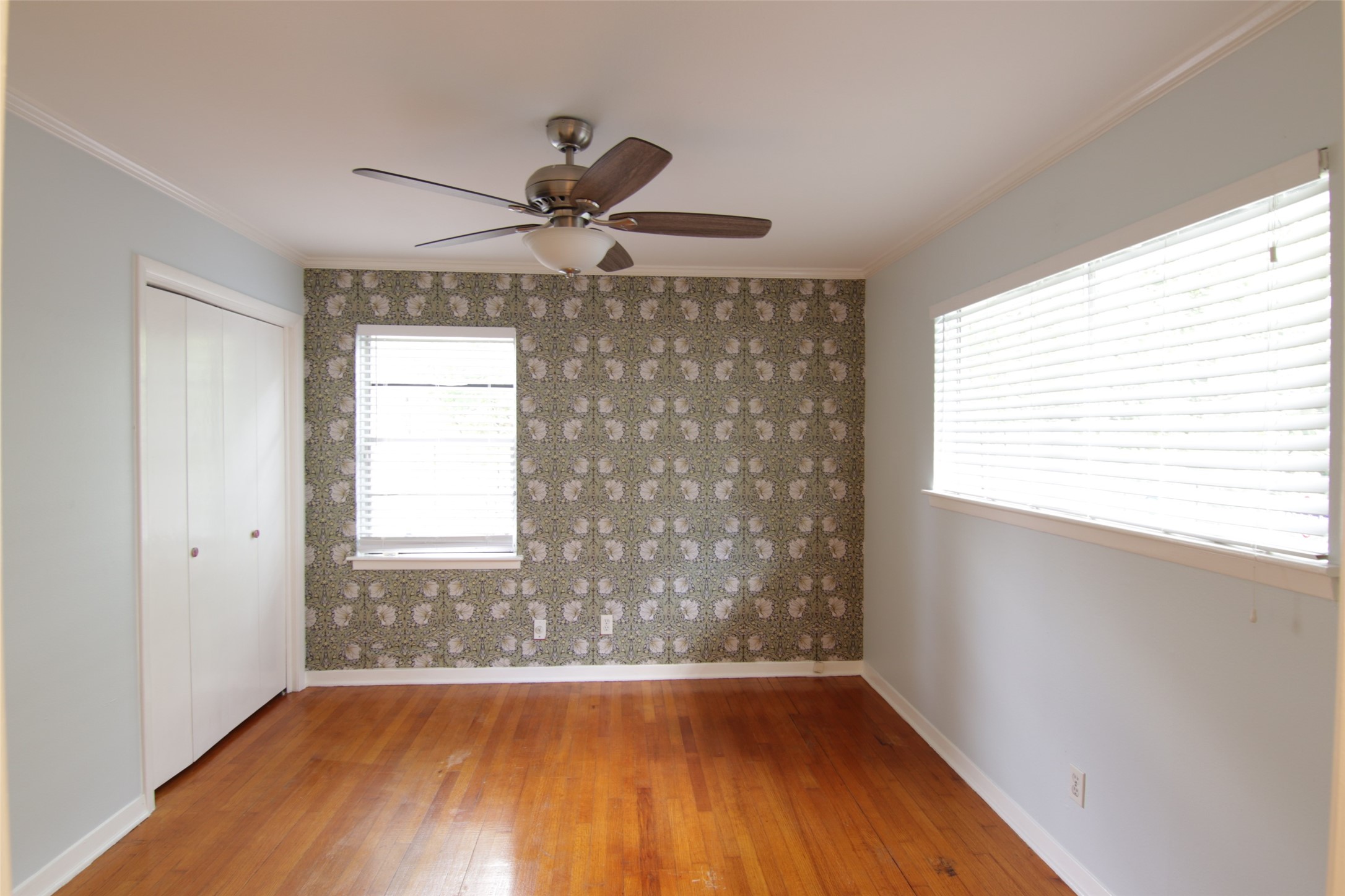 7030 Sharpview Drive Houston, TX 77074 - Photo 11 of 20 a view of an empty room with wooden floor and a window