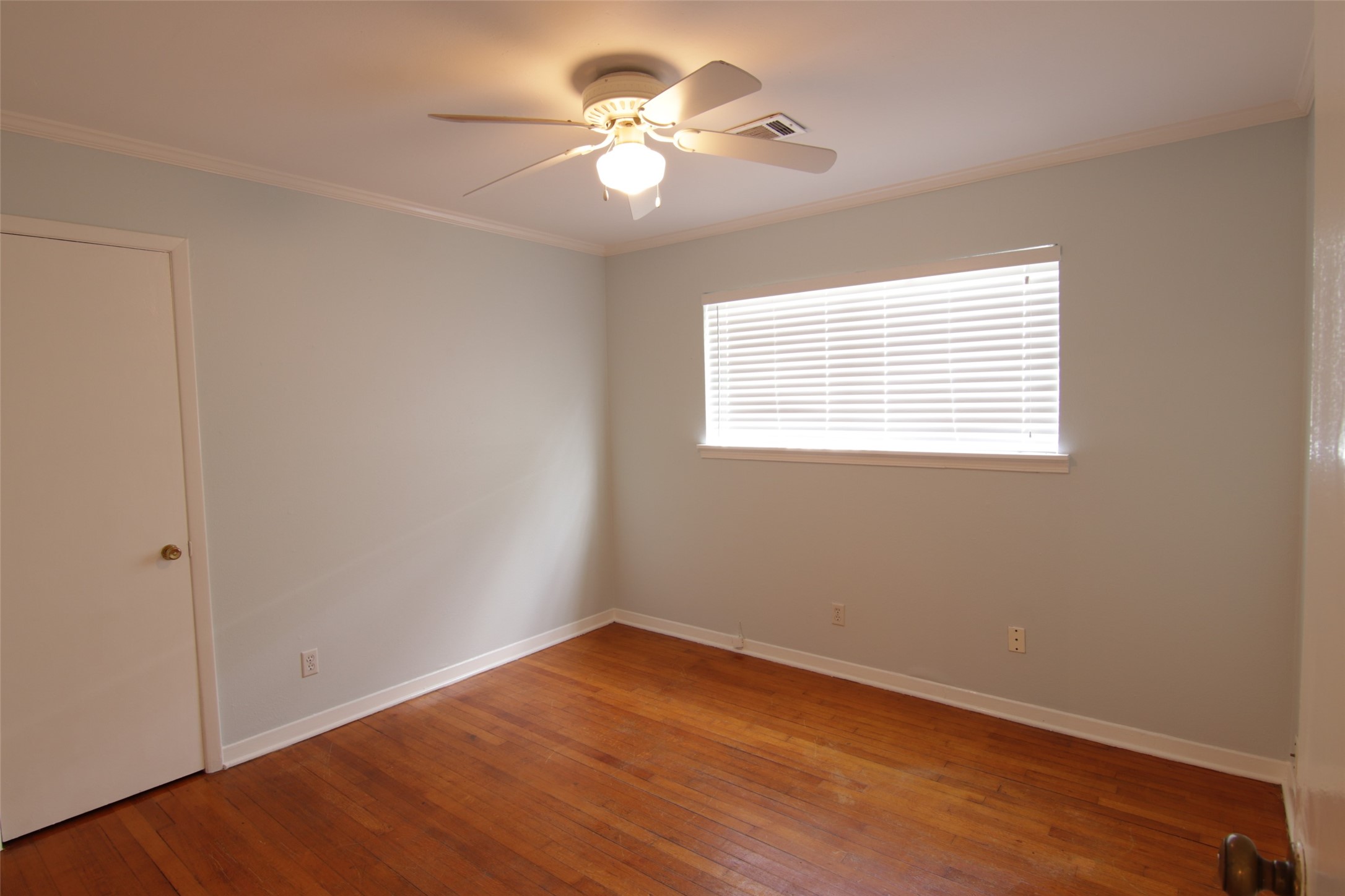 7030 Sharpview Drive Houston, TX 77074 - Photo 13 of 20 a view of a room with a fan & a window